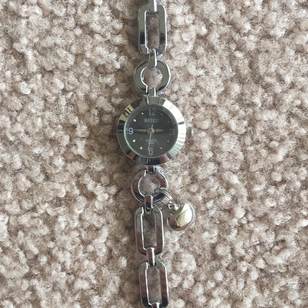 Vintage silver watch with charm